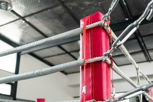 Boxing ring in the corner. Empty ring geared-up for fight boxers photo