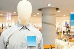 mannequin dressed in casual clothes. shelf display in shop mall store. Store Of Shopping Center. photo