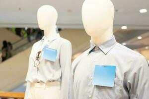 mannequin dressed in casual clothes. shelf display in shop mall store. Store Of Shopping Center. photo