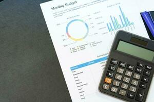 Budget planning concept. Business  Planning Strategy Analysis discussing new plan financial graph data. Work with document graphs and calculator Concept. photo