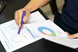 Budget planning concept. Business  Planning Strategy Analysis discussing new plan financial graph data. Work with document graphs and calculator Concept. photo