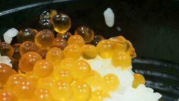 Close up of sashimi salmon roe with rice bowl or donburi in Japanese style food. photo