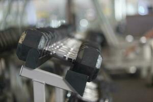 Dumbbells on a weight rack photo