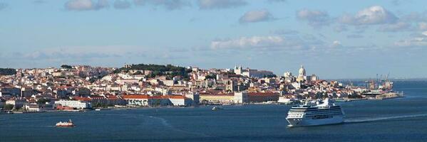 Cruise ship passing in front of Lisbon photo