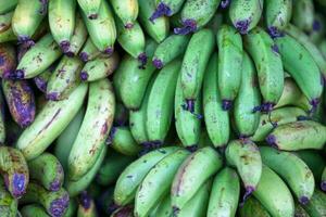 Stack of bananas on a market stall photo