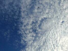 The white clouds on the blue sky are perfect for the background.  Skyscape on Lombok Island, Indonesia photo