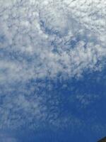 The white clouds on the blue sky are perfect for the background.  Skyscape on Lombok Island, Indonesia photo