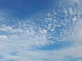 The white clouds on the blue sky are perfect for the background.  Skyscape on Lombok Island, Indonesia photo