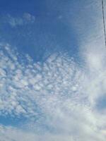 The white clouds on the blue sky are perfect for the background.  Skyscape on Lombok Island, Indonesia photo