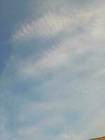 The white clouds on the blue sky are perfect for the background.  Skyscape on Lombok Island, Indonesia photo