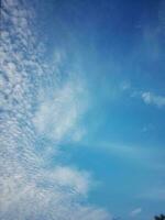 The white clouds on the blue sky are perfect for the background.  Skyscape on Lombok Island, Indonesia photo