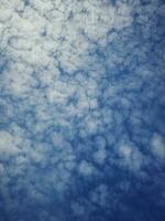 The white clouds on the blue sky are perfect for the background.  Skyscape on Lombok Island, Indonesia photo