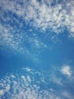 The white clouds on the blue sky are perfect for the background.  Skyscape on Lombok Island, Indonesia photo