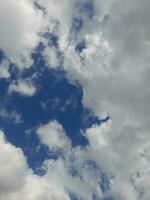 The white clouds on the blue sky are perfect for the background.  Skyscape on Lombok Island, Indonesia photo