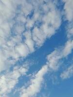 The white clouds on the blue sky are perfect for the background.  Skyscape on Lombok Island, Indonesia photo