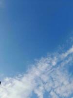 The white clouds on the blue sky are perfect for the background.  Skyscape on Lombok Island, Indonesia photo