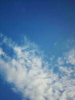 The white clouds on the blue sky are perfect for the background.  Skyscape on Lombok Island, Indonesia photo