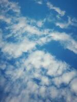 The white clouds on the blue sky are perfect for the background.  Skyscape on Lombok Island, Indonesia photo