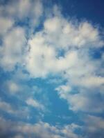 The white clouds on the blue sky are perfect for the background.  Skyscape on Lombok Island, Indonesia photo