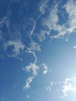 The white clouds on the blue sky are perfect for the background.  Skyscape on Lombok Island, Indonesia photo