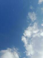 The white clouds on the blue sky are perfect for the background.  Skyscape on Lombok Island, Indonesia photo