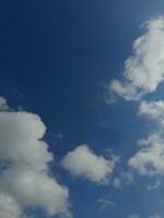 The white clouds on the blue sky are perfect for the background.  Skyscape on Lombok Island, Indonesia photo