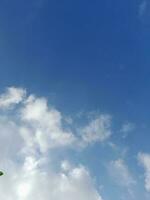 The white clouds on the blue sky are perfect for the background.  Skyscape on Lombok Island, Indonesia photo