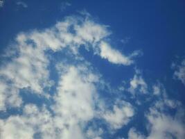 The white clouds on the blue sky are perfect for the background.  Skyscape on Lombok Island, Indonesia photo