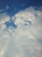 The white clouds on the blue sky are perfect for the background.  Skyscape on Lombok Island, Indonesia photo