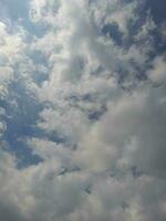 The white clouds on the blue sky are perfect for the background.  Skyscape on Lombok Island, Indonesia photo