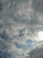 The white clouds on the blue sky are perfect for the background.  Skyscape on Lombok Island, Indonesia photo