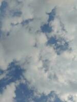 The white clouds on the blue sky are perfect for the background.  Skyscape on Lombok Island, Indonesia photo