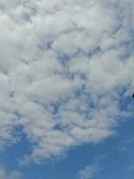 The white clouds on the blue sky are perfect for the background.  Skyscape on Lombok Island, Indonesia photo