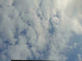 The white clouds on the blue sky are perfect for the background.  Skyscape on Lombok Island, Indonesia photo