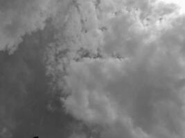 Beautiful grey clouds on sky background. Large bright soft fluffy clouds are cover the entire sky. photo