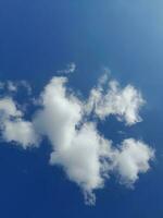 The white clouds on the blue sky are perfect for the background.  Skyscape on Lombok Island, Indonesia photo