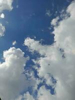 The white clouds on the blue sky are perfect for the background.  Skyscape on Lombok Island, Indonesia photo