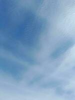 The white clouds on the blue sky are perfect for the background.  Skyscape on Lombok Island, Indonesia photo