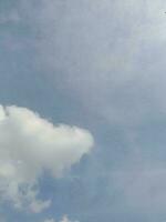 The white clouds on the blue sky are perfect for the background.  Skyscape on Lombok Island, Indonesia photo