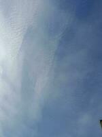 The white clouds on the blue sky are perfect for the background.  Skyscape on Lombok Island, Indonesia photo