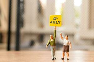 Americans raising flags in celebration of the Fourth of July and Independence Day photo