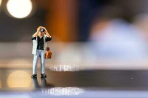 Miniature people Photography holding a camera and copy space for text photo