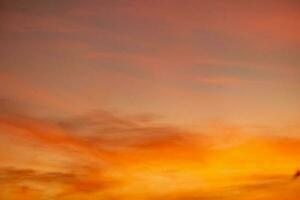 beautiful , luxury soft gradient orange gold clouds and sunlight on the blue sky perfect for the background, take in everning,Twilight photo