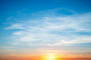 beautiful , luxury soft gradient orange gold clouds and sunlight on the blue sky perfect for the background, take in everning,Twilight photo