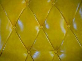 textura amarillo terciopelo modelo antecedentes textil Clásico sofá estilo suave a cuadros Costura mueble de cerca modelo foto