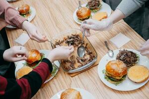 Burgers with beef and vegetables. Close up. Delicious burgers in a cooking class. Burger with cranberry sauce and Burger with onion sauce. photo