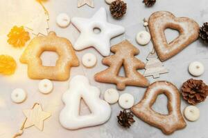 Banner for Christmas and New Year gingerbread stars, houses, Christmas trees, toys on a gray concrete background photo