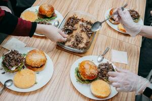 Burgers with beef and vegetables. Close up. Delicious burgers in a cooking class. Burger with cranberry sauce and Burger with onion sauce. photo