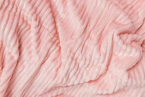 New soft pink fabric with waves and lines. Abstract texture background, closeup photo