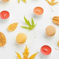 Autumn flat layout with candles, leaves, macaroons photo